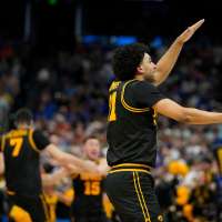 Iowa beats No. 1 seed and defending champ Florida in March Madness on Folgueiras' 3 in final seconds