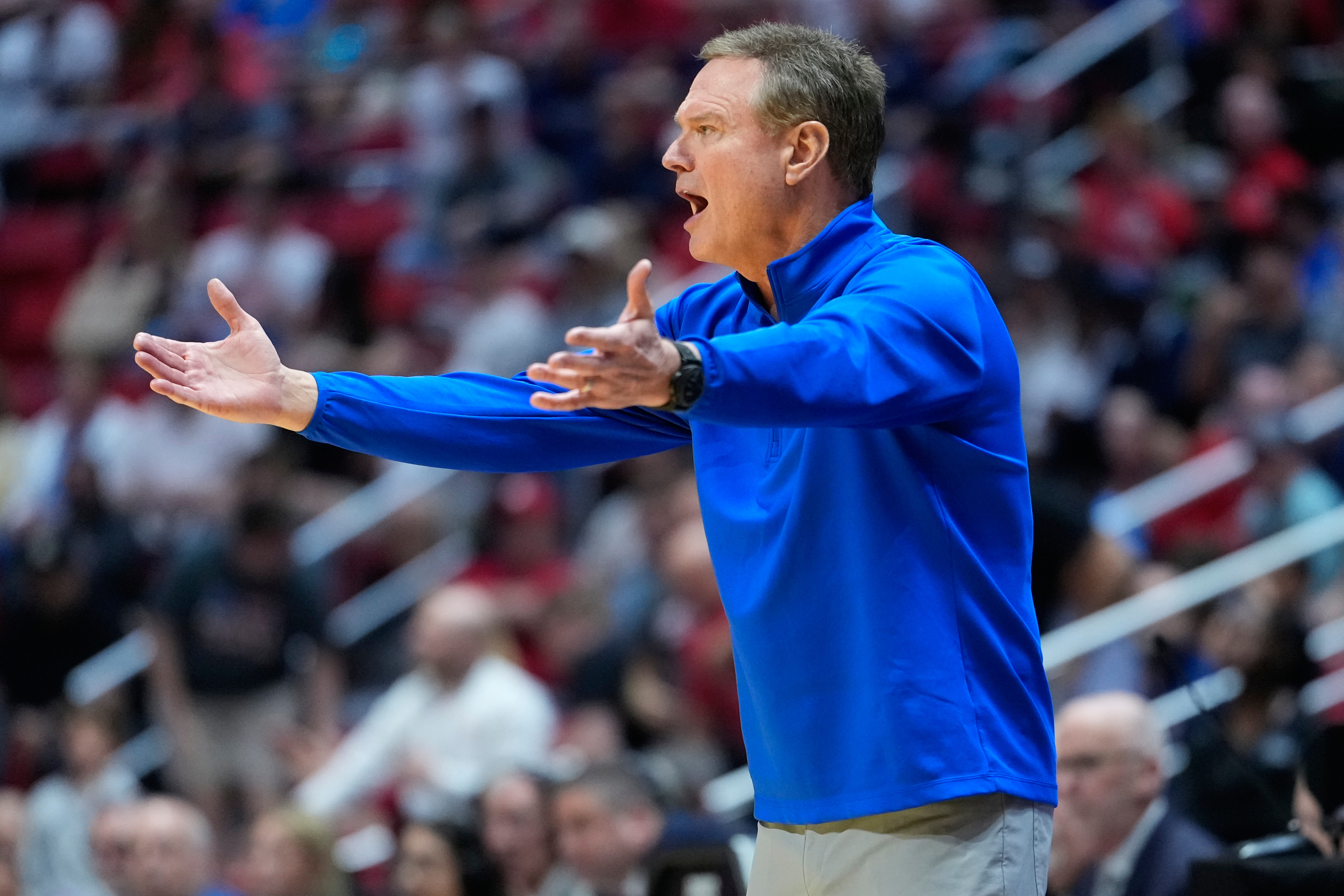 Kansas head coach Bill Self motions towards the court during the first half of a game between Kansas and St. John's in the second round of the NCAA college basketball tournament Sunday, March 22, 2026, in San Diego. 