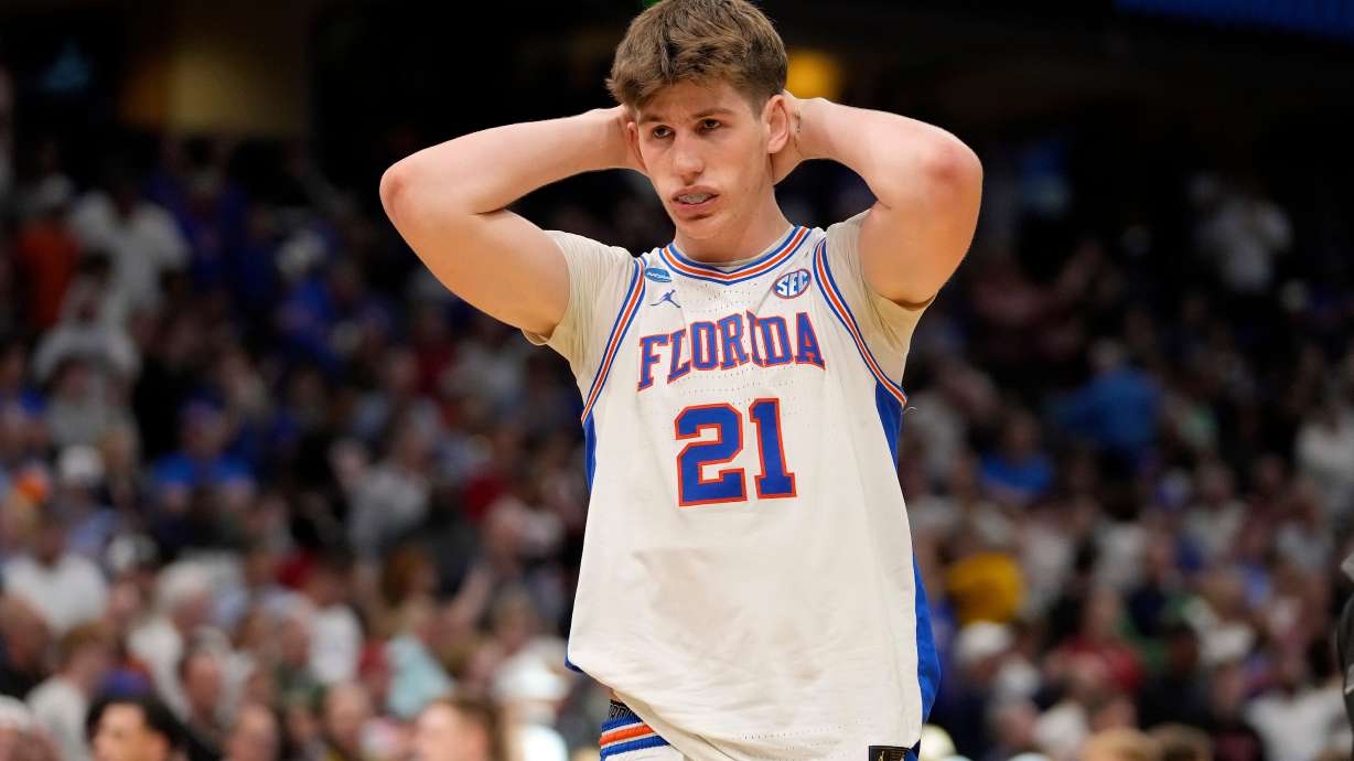 Florida forward Alex Condon (21) reacts after the team lost to Iowa during the second round of the NCAA college basketball tournament Sunday, March 22, 2026, in Tampa, Fla.