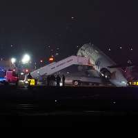 2 killed in collision between jet and fire truck at New York's LaGuardia Airport