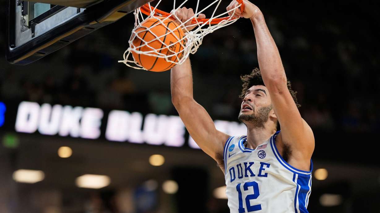 Duke forward Cameron Boozer dunks against TCU during the second half in the second round of the NCAA college basketball tournament, Saturday, March 21, 2026, in Greenville, S.C.