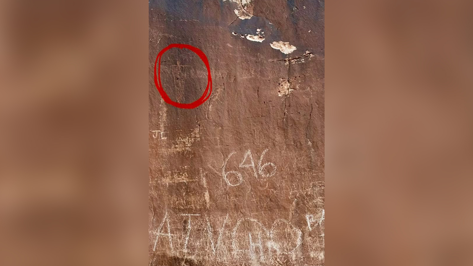 An image of a vandalized petroglyph is pictured near Tusher Tunnel in Grand County. The Grand County Sheriff's Office said Sunday they're still investigating the incident.