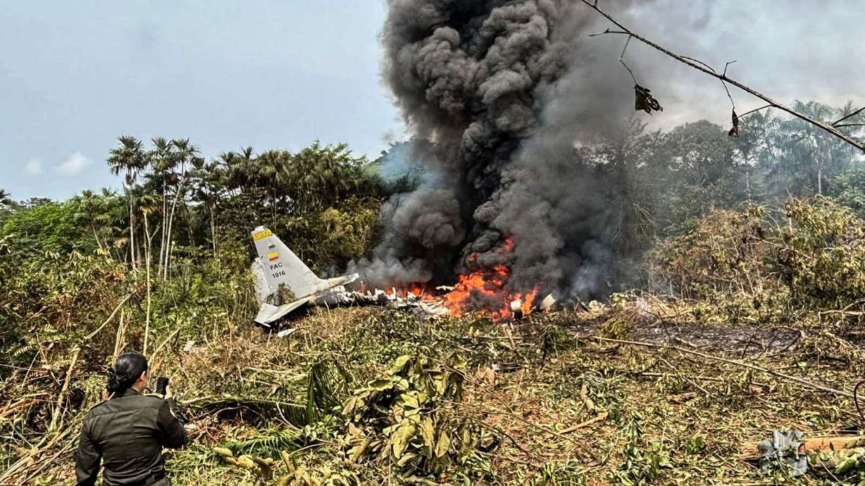 Flames and thick black smoke rise from the Colombian military plane that crashed in Puerto Leguizamo, near the border with Ecuador, on Monday.