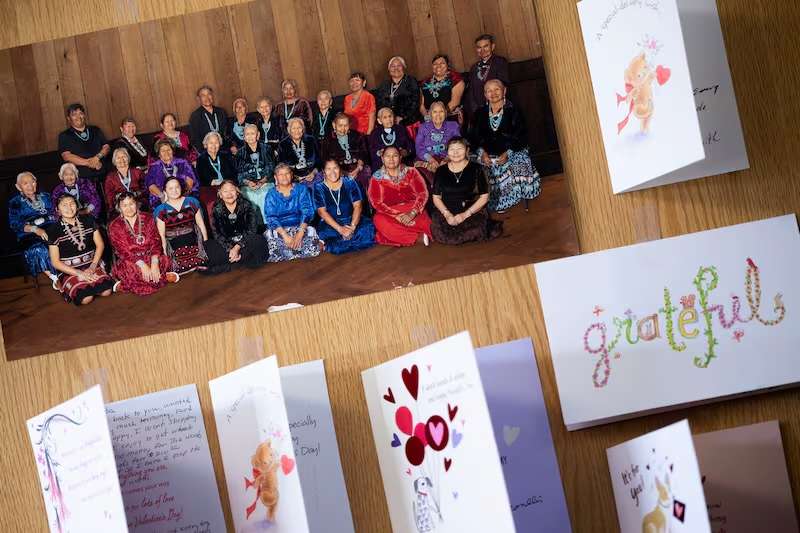 Pictures and cards are displayed on the office door of Linda Myers, founder of Adopt-A-Native-Elder, a nonprofit organization working to help reduce extreme poverty and hardship facing traditional Elders living on the Navajo Reservation in southern Utah and northern Arizona, as she talks about the program and the volunteers during an interview in Salt Lake City on Feb. 27.