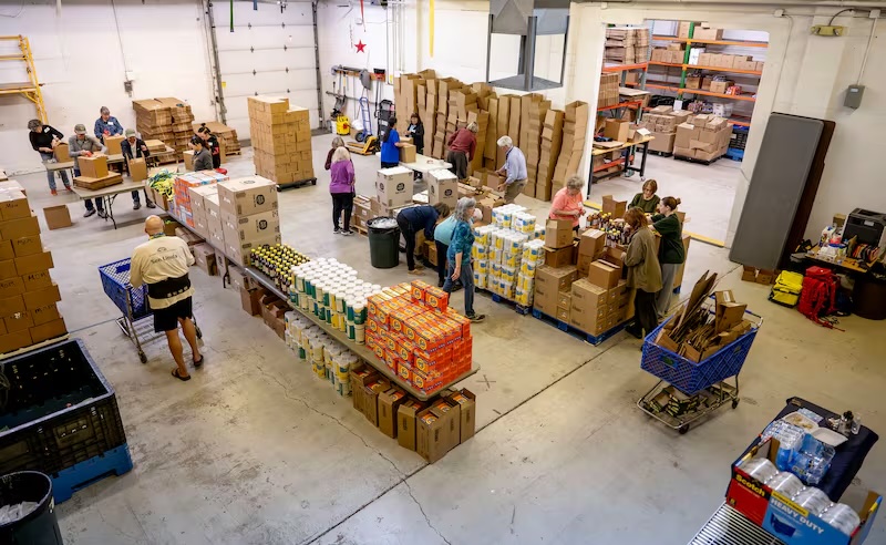 Linda Myers, founder of Adopt-A-Native-Elder, a nonprofit organization working to help reduce extreme poverty and hardship facing traditional Elders living on the Navajo Reservation in southern Utah and northern Arizona, talks about the program and volunteers' work in the warehouse in Salt Lake City on Feb. 27.