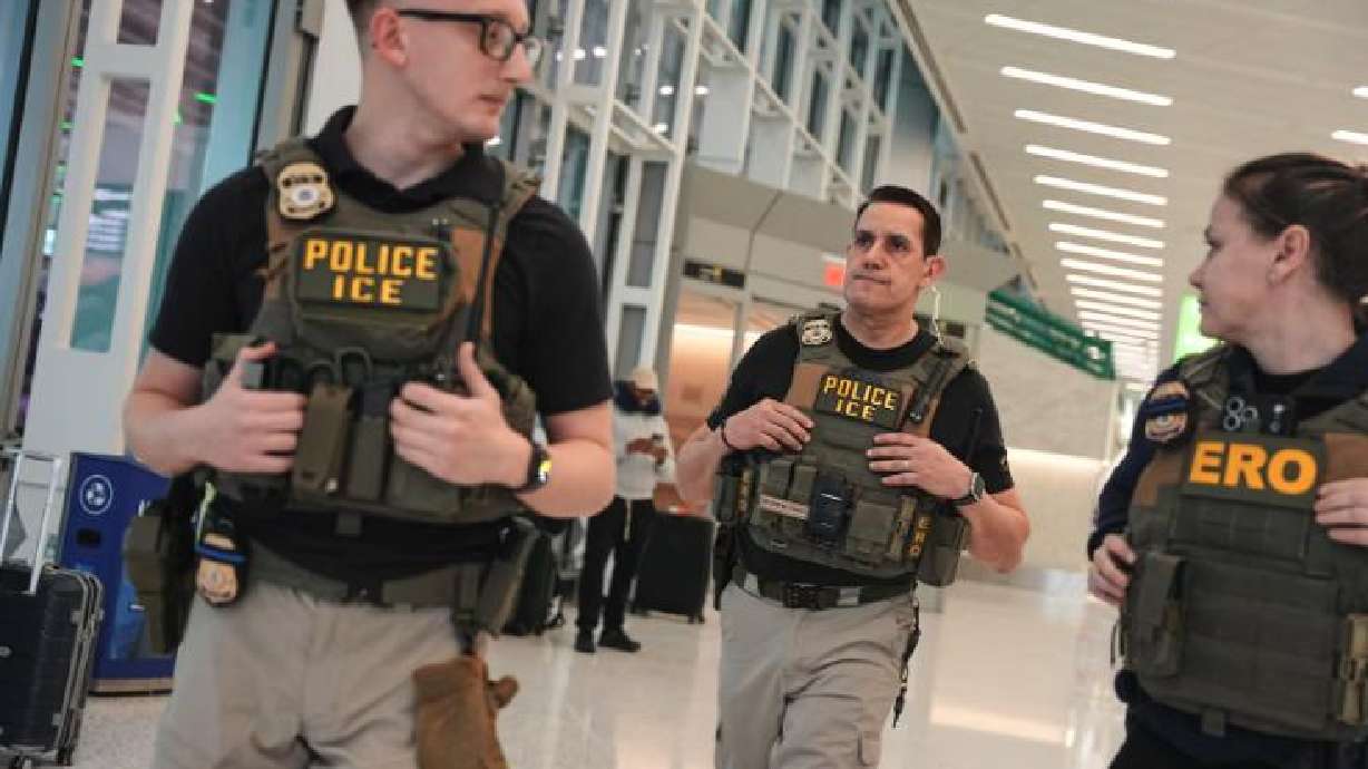 Federal immigration agents are seen at Newark Liberty International Airport, Monday, in Newark, N.J.