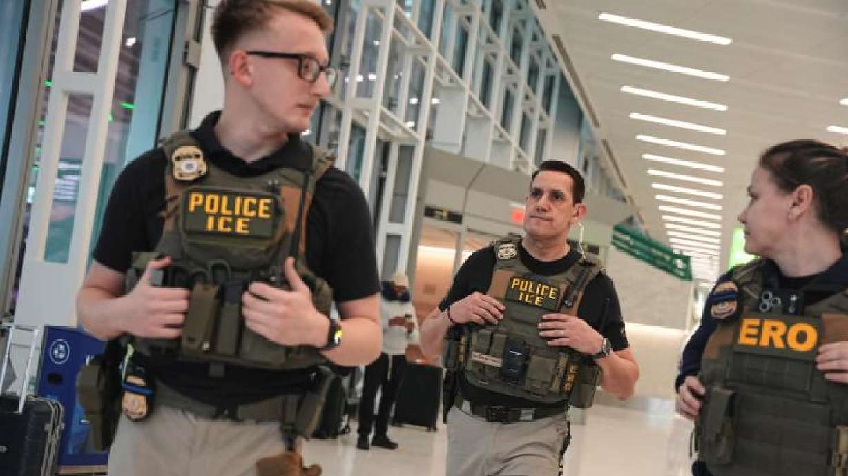 Federal immigration agents are seen at Newark Liberty International Airport, Monday, in Newark, N.J.