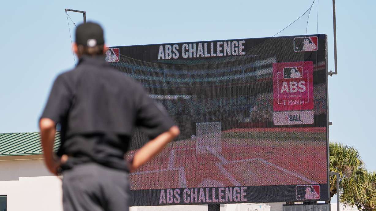 Umpire Ryan Additon watches as a call is challenged using MLB's ABS challenge system during the third inning of a spring training baseball game between the Miami Marlins and the Houston Astros Wednesday, Feb. 25, 2026, in Jupiter, Fla.