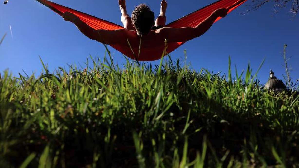 Eugene Raymond of Salt Lake City swings in his hammock in Salt Lake City on Wednesday. Seasonal allergies are getting an earlier-than-usual start, courtesy of unseasonably warm weather in parts of the country, including the Intermountain West.