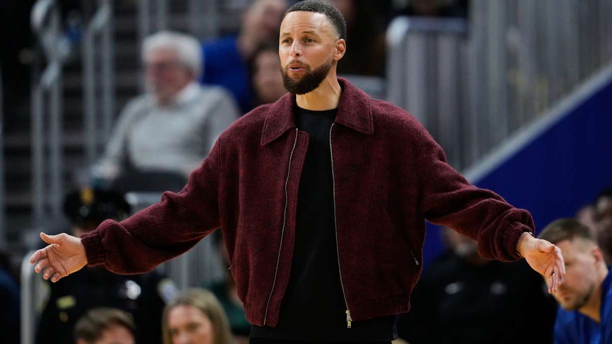 Golden State Warriors' Stephen Curry reacts from the bench during the second half of an NBA basketball game against the Minnesota Timberwolves, Friday, March 13, 2026, in San Francisco.
