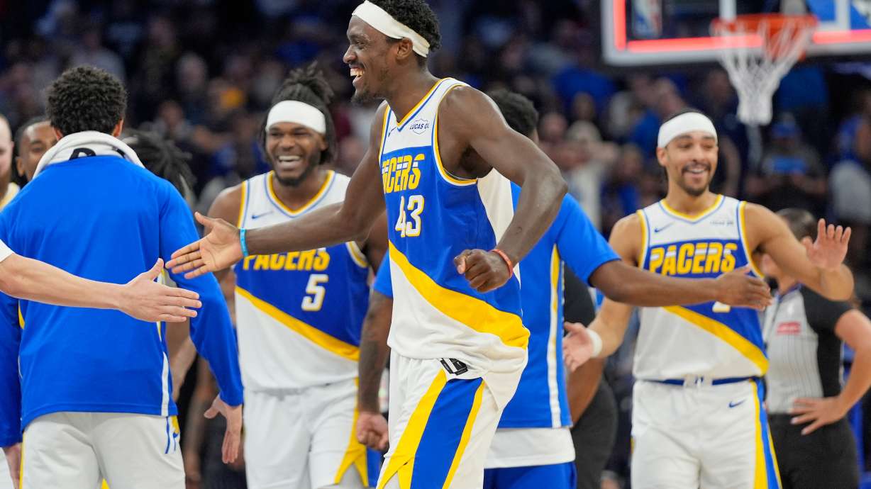 Indiana Pacers forward Pascal Siakam (43) celebrates with teammates including forward Jarace Walker (5) and guard Andrew Nembhard, right, after defeating the Orlando Magic in an NBA basketball game, Monday, March 23, 2026, in Orlando, Fla.