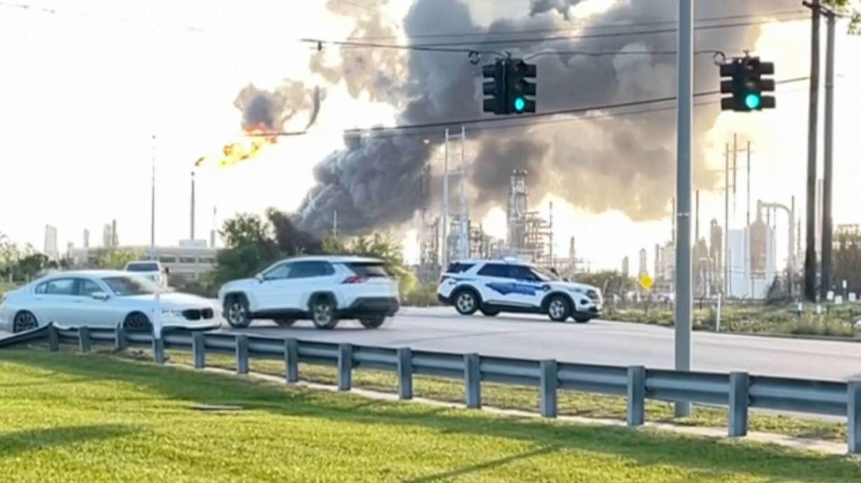 In this still image taken from a video provided by KBMT, smoke rises near the Valero Port Arthur Refinery in Port Arthur, Texas Monday.