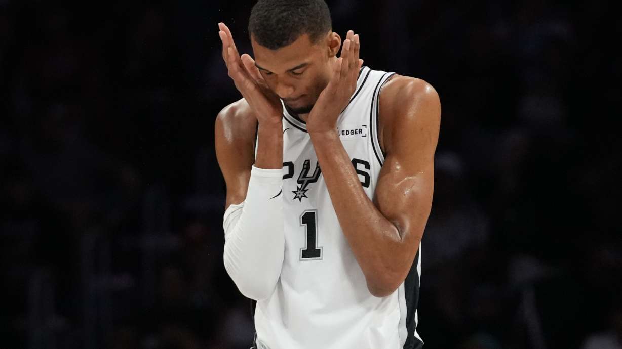 San Antonio Spurs forward Victor Wembanyama (1) walks on the court during the first half of an NBA basketball game against the Miami Heat, Monday, March 23, 2026, in Miami.