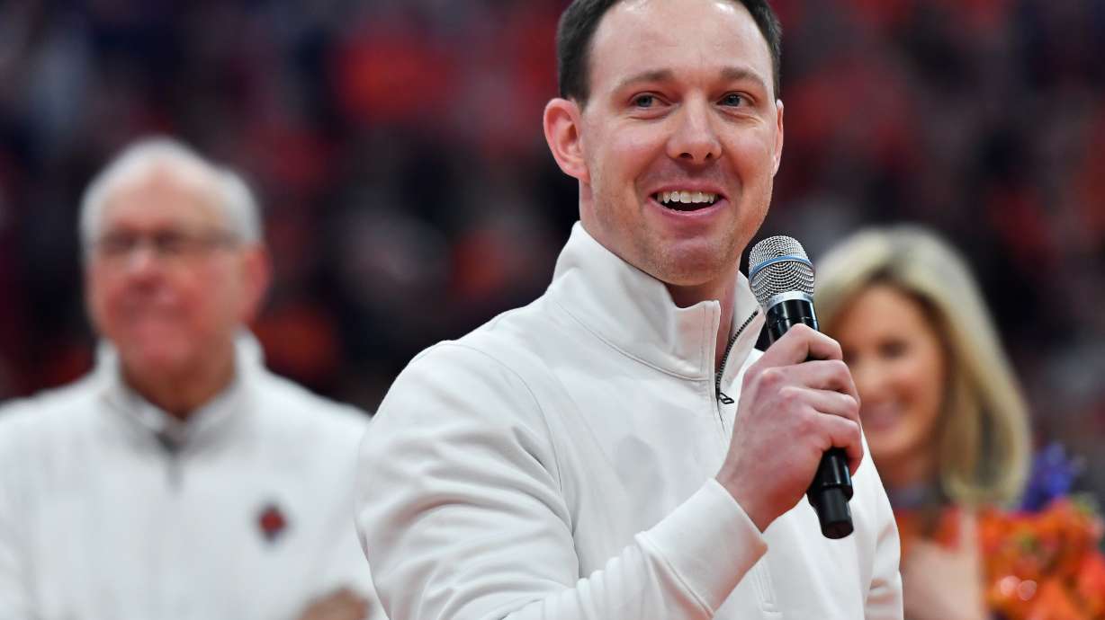 FILE - Syracuse assistant coach Gerry McNamara, now head coach at Siena, gives remarks at his jersey retirement ceremony after an NCAA college basketball game against Wake Forest in Syracuse, N.Y., Saturday, March 4, 2023.