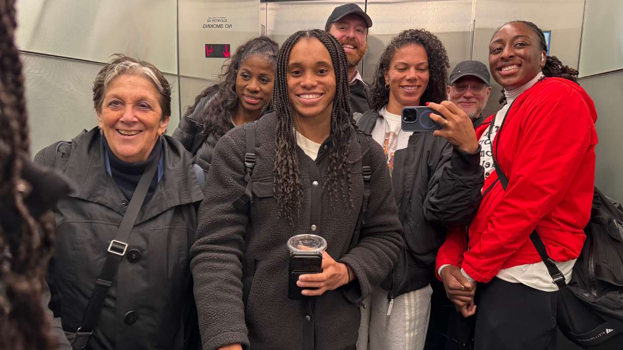 WNBA players and union members pose for a photo in an elevator after a negotiating session at the NBA headquarters on March 13, 2026, in New York.