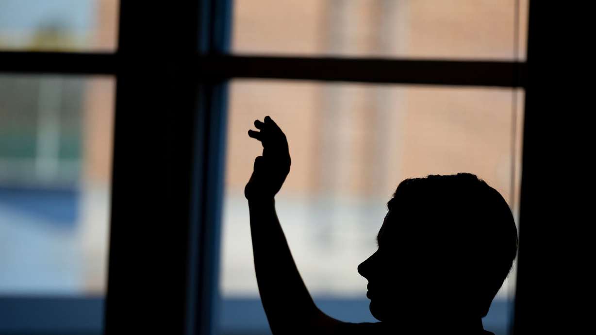A student raises their hand at Jordan High School in Sandy on Jan. 15. A new teacher discipline bill is still sitting at Gov. Spencer Cox's desk, leaving many on edge to see whether he signs or vetoes it.