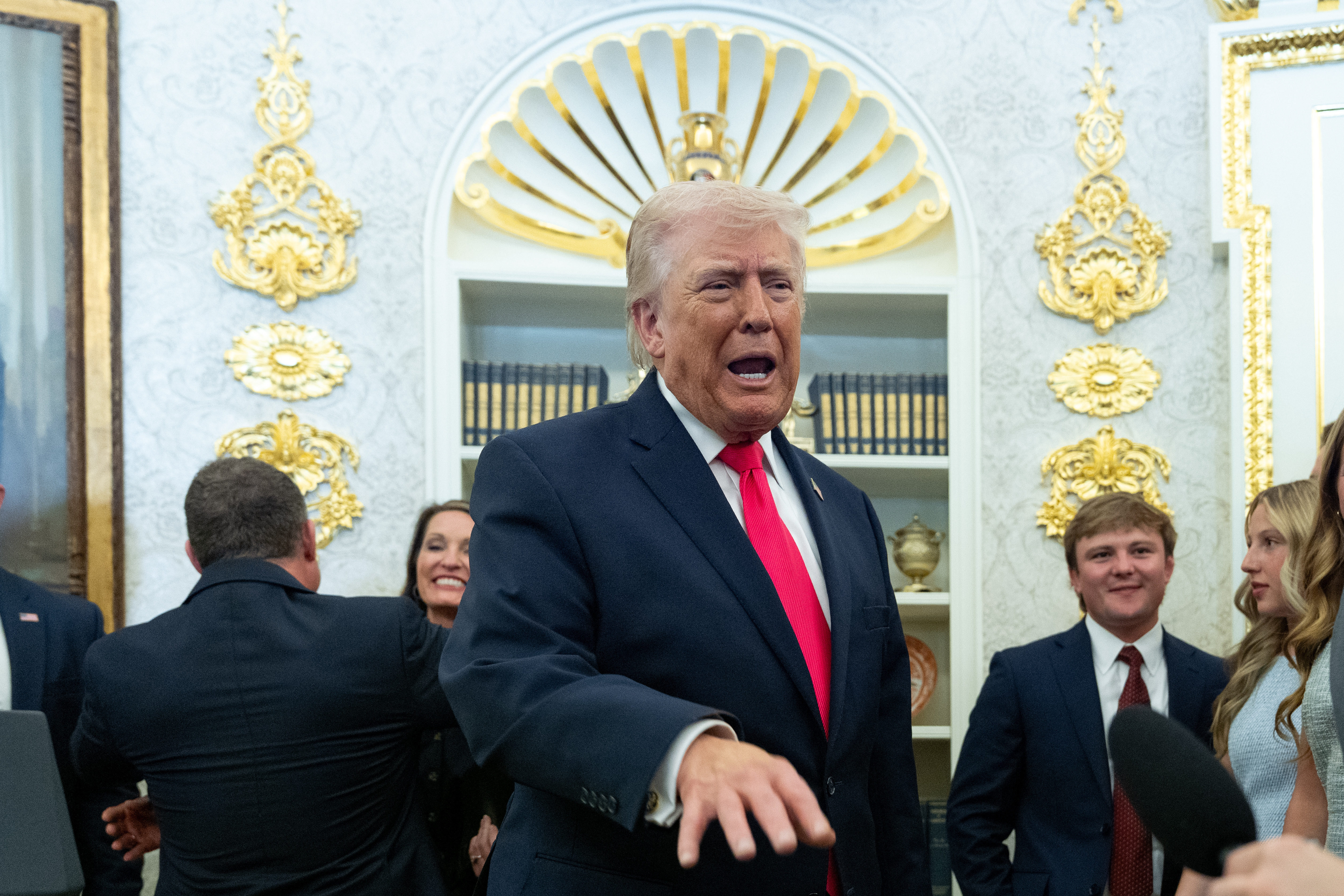 President Donald Trump speaks with reporters during the swearing-in ceremony for Homeland Security Secretary Markwayne Mullin in the Oval Office of the White House, Tuesday, in Washington. Democrat Emily Gregory won a Florida special election on Tuesday.
