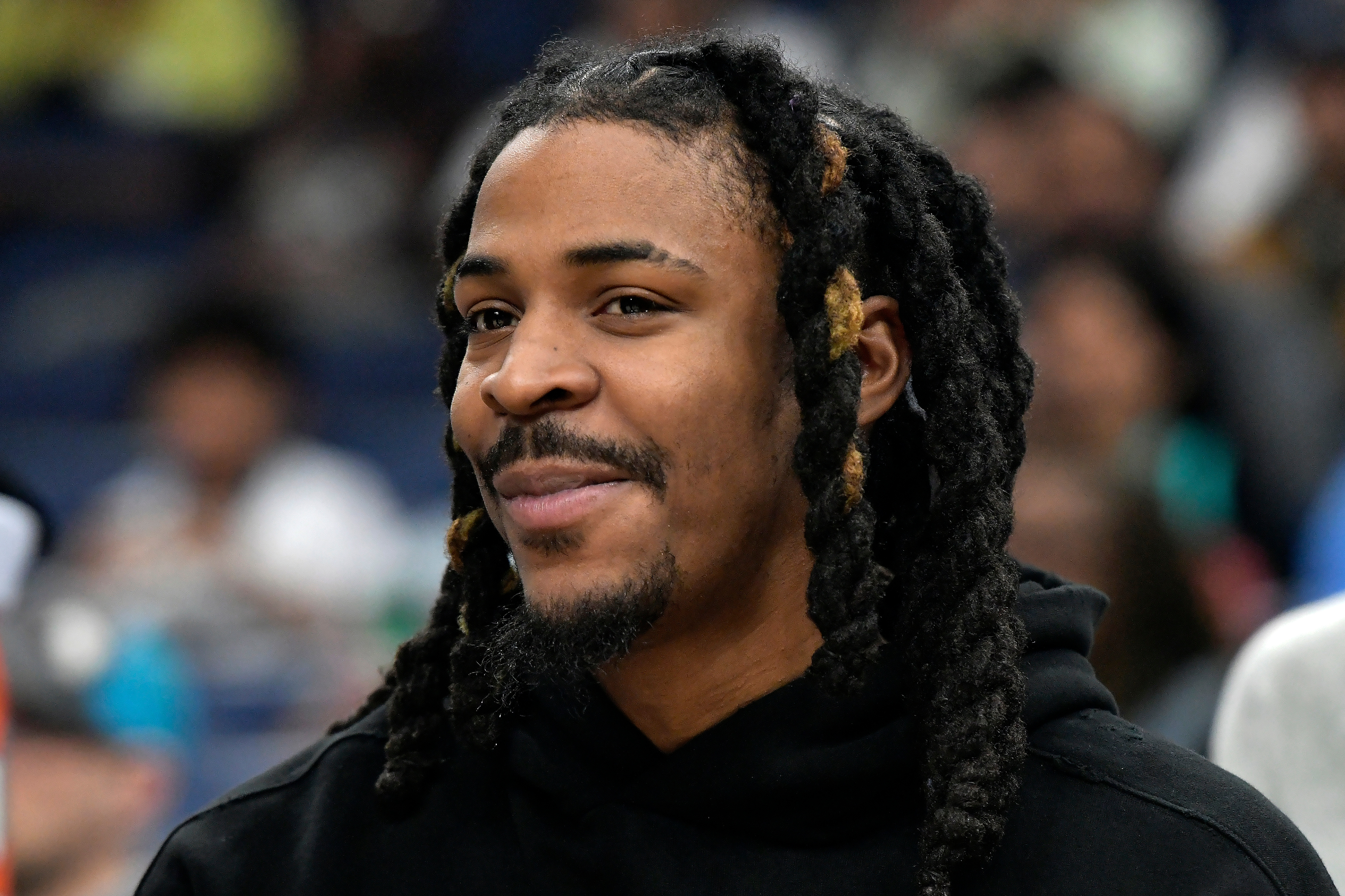 Memphis Grizzlies guard Ja Morant looks on from the bench in the first half of an NBA basketball game against the Portland Trail Blazers, Wednesday, March 4, 2026, in Memphis, Tenn. 