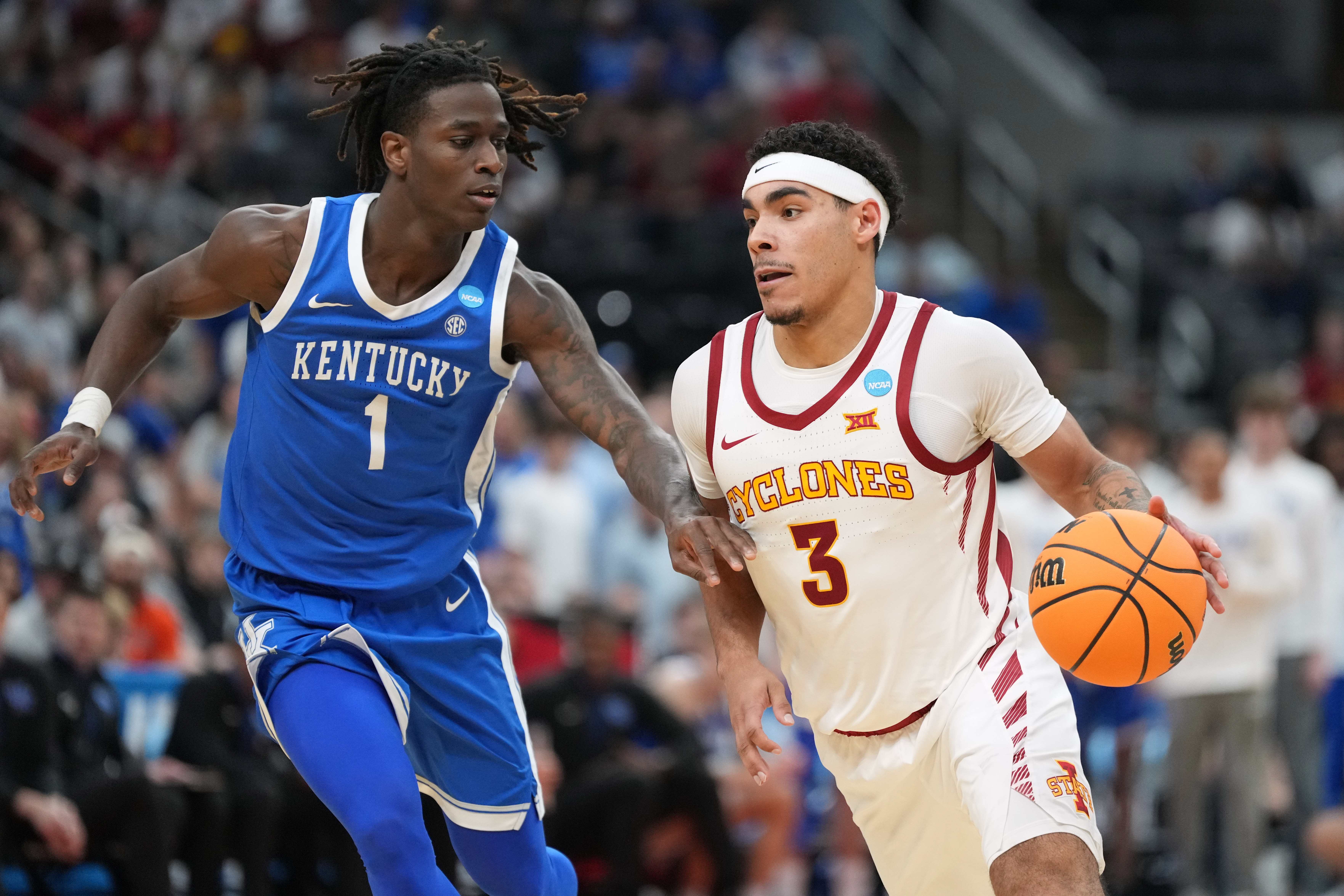 Iowa State's Tamin Lipsey (3) drives past Kentucky's Denzel Aberdeen (1) during the second half in the second round of the NCAA college basketball tournament, Sunday, March 22, 2026, in St. Louis. 