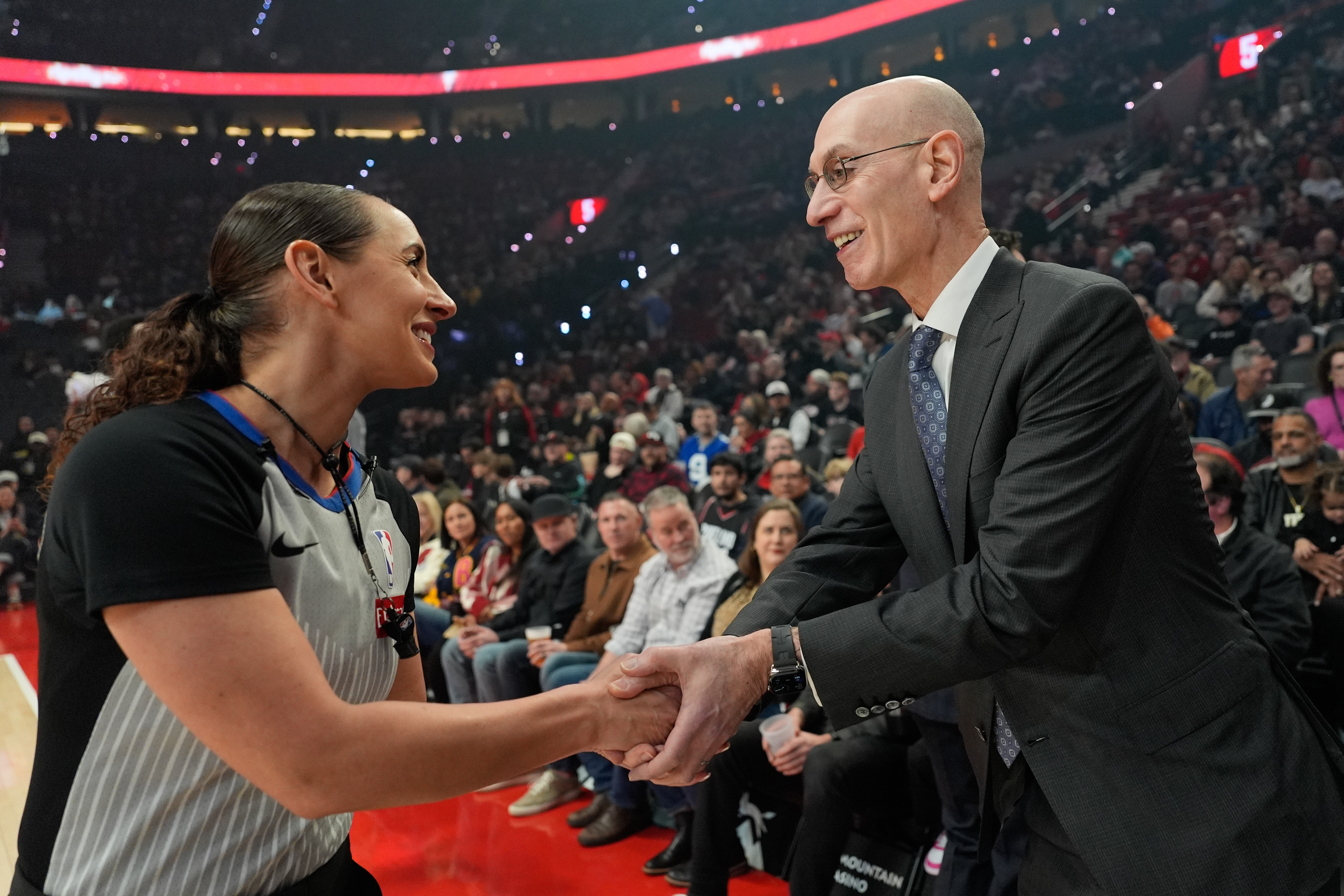 NBA commissioner Adam Silver greets NBA referee Ashley Moyer-Gleich as he arrives for an NBA basketball game between the Portland Trail Blazers and the Utah Jazz, Friday, March 13, 2026, in Portland, Ore.
