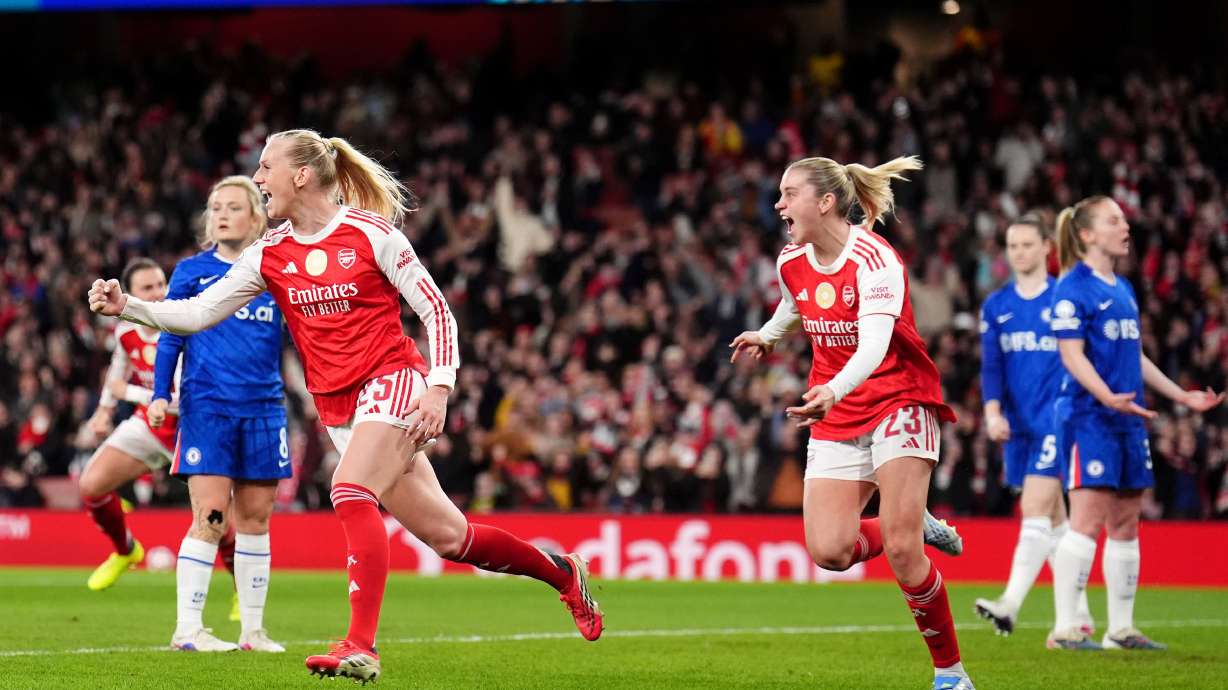 Arsenal's Stina Blackstenius, left, celebrates scoring their side's first goal of the game during the Women's Champions League soccer match between Arsenal and Chelsea in London, Tuesday, March 24, 2026.