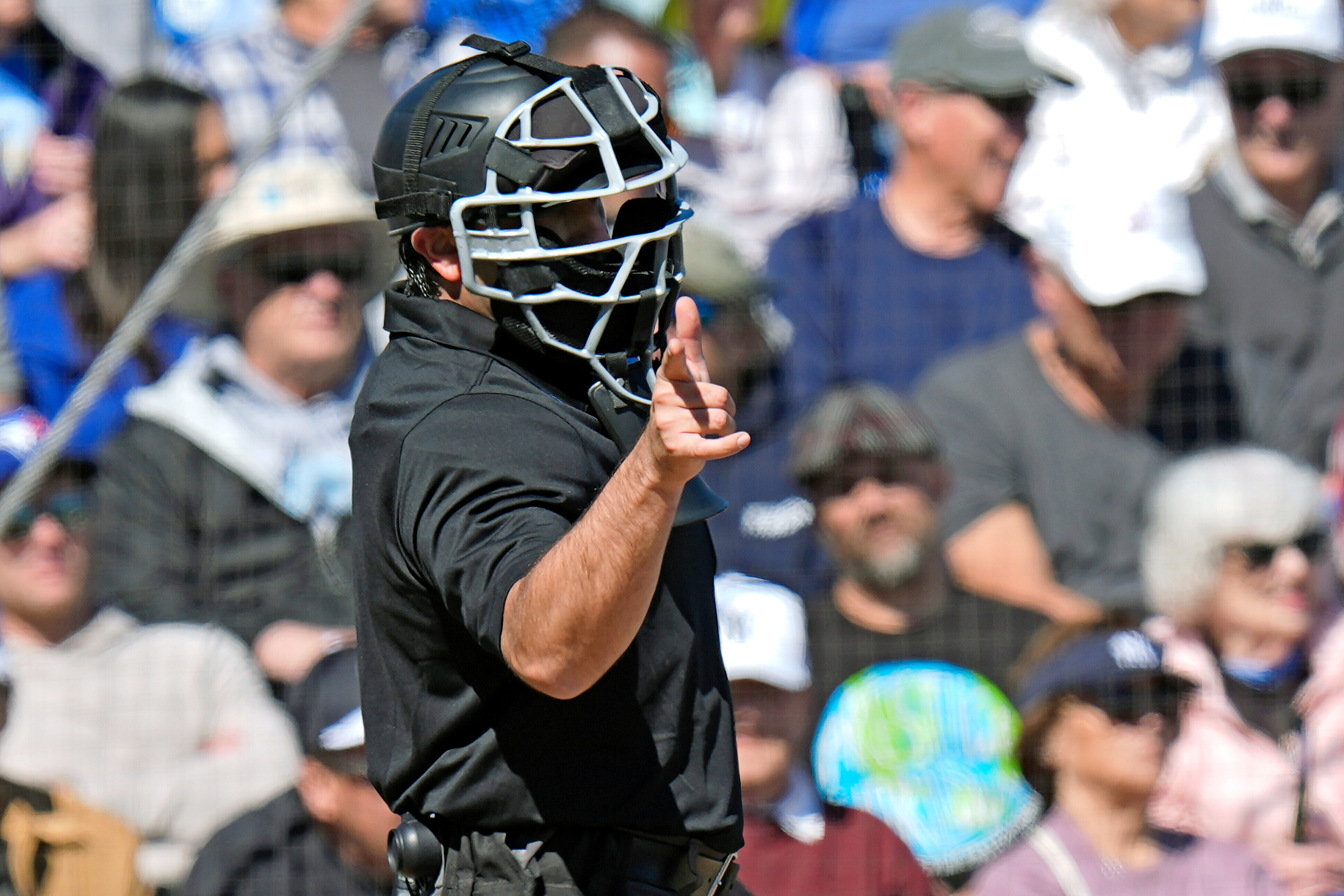 FILE 0 Home plate umpire Tom Fornarola calls a strike during the fifth inning of a spring training baseball game between the Toronto Blue Jays and the New York Yankees Tuesday, Feb. 24, 2026, in Dunedin, Fla. 