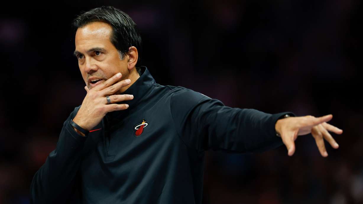 Miami Heat head coach Erik Spoelstra directs his team during the first half of an NBA basketball game against the Charlotte Hornets in Charlotte, N.C., Friday, March 6, 2026.