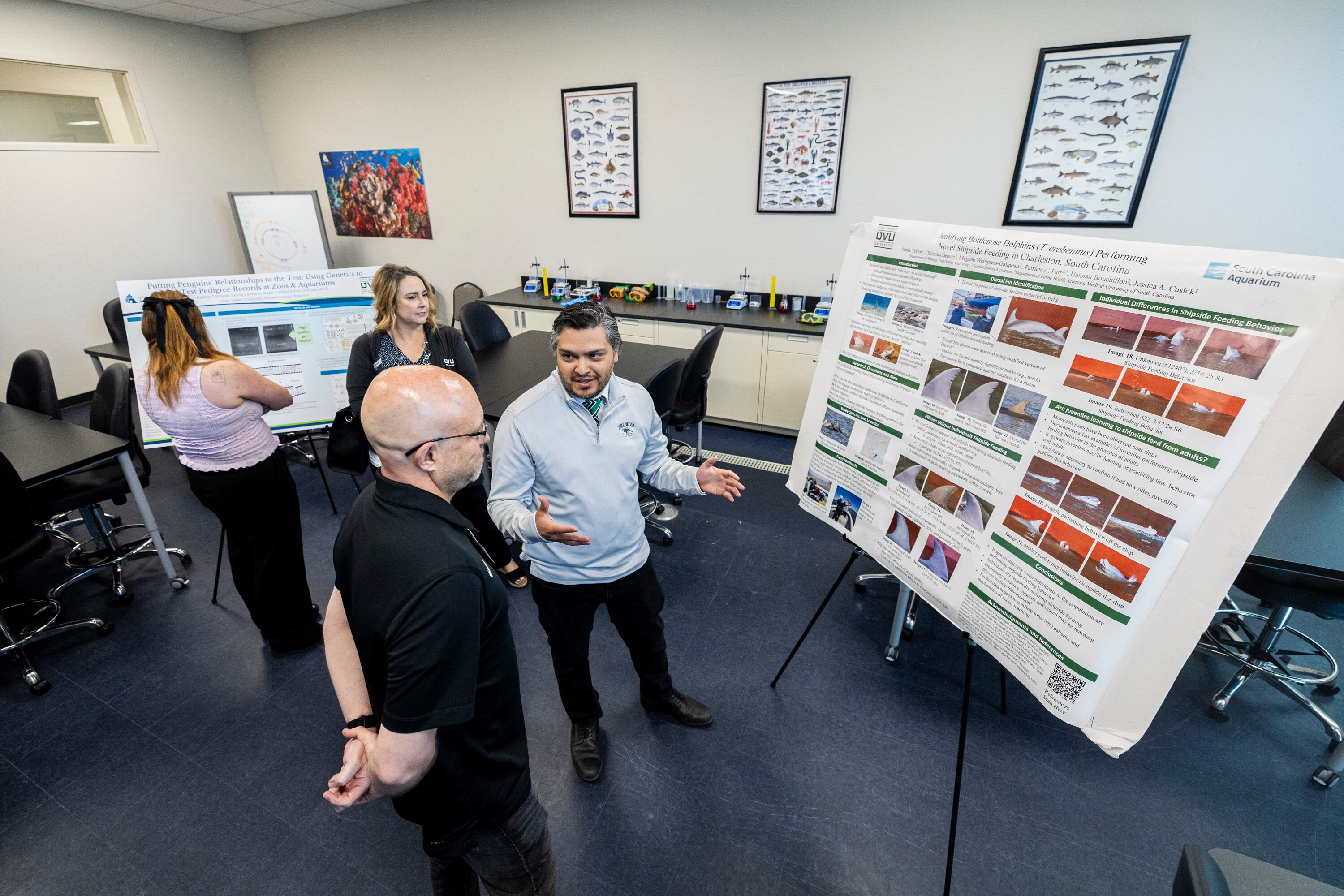 Chris Gonzalez, a marketing manager with Utah Valley University’s College of Science, explains research to attendees in UVU’s new lab area during an event announcing a partnership between UVU and the Loveland Living Planet Aquarium in Draper on Wednesday.