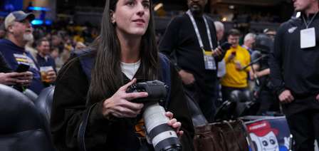 Caitlin Clark works as a photographer for the Indiana Pacers as they host LeBron and the Lakers
