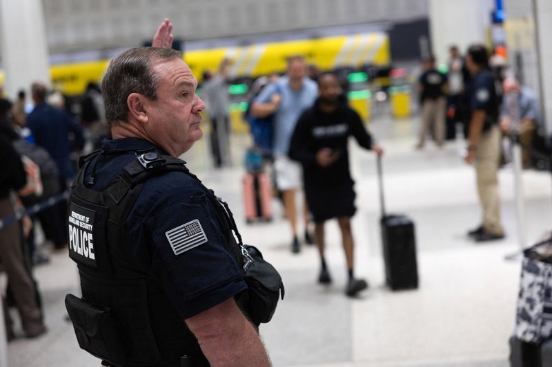Long TSA lines at the George Bush Intercontinental Airport in Houston, Texas, Wednesday. President Donald Trump said on Thursday he would sign an order to immediately pay TSA agents.