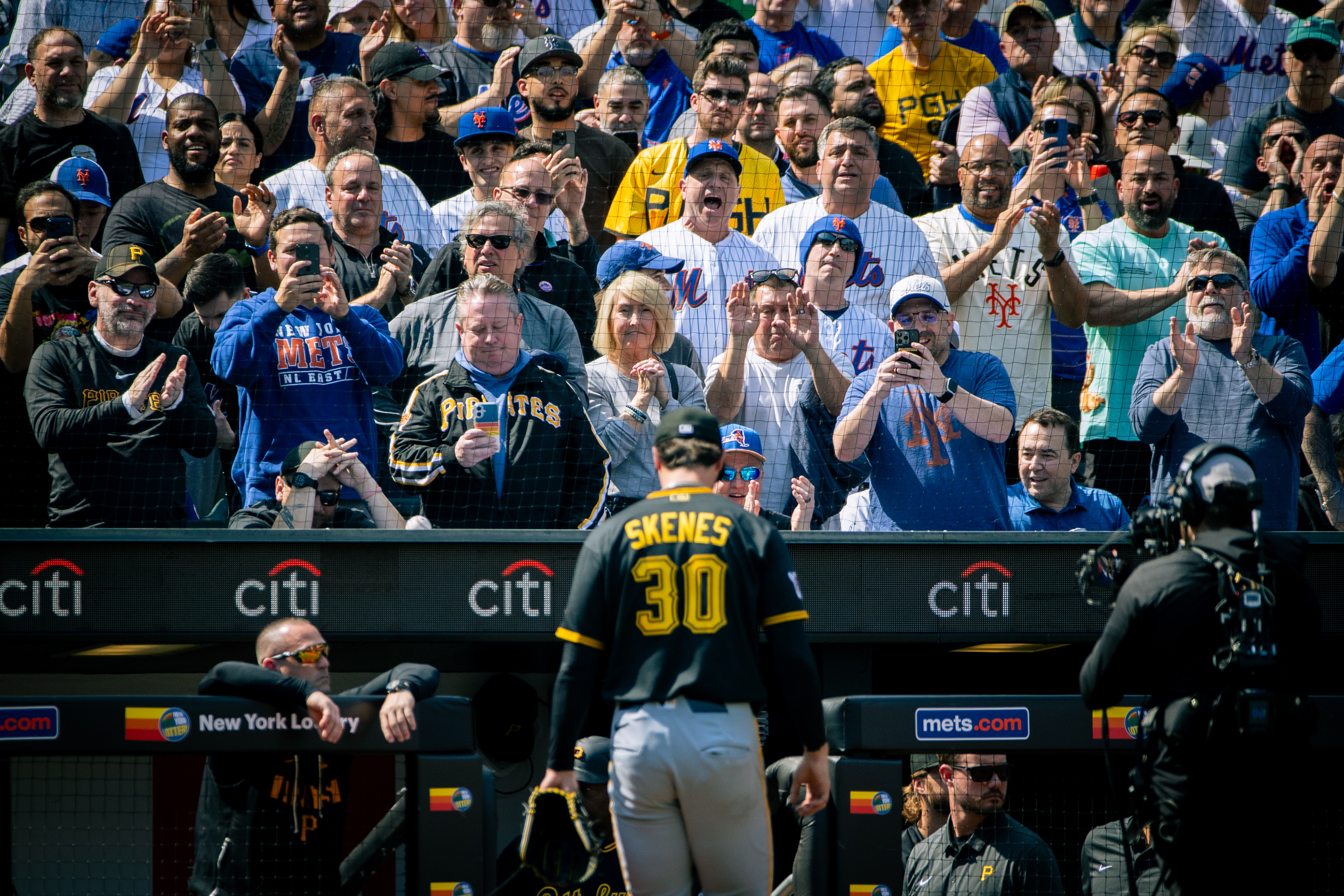 The crowd cheers and jeers as Pittsburgh Pirates pitcher Paul Skenes (30) exits the field after he was relieved in the first inning of an opening-day baseball game against the New York Mets, Thursday, March 26, 2026, in New York. 