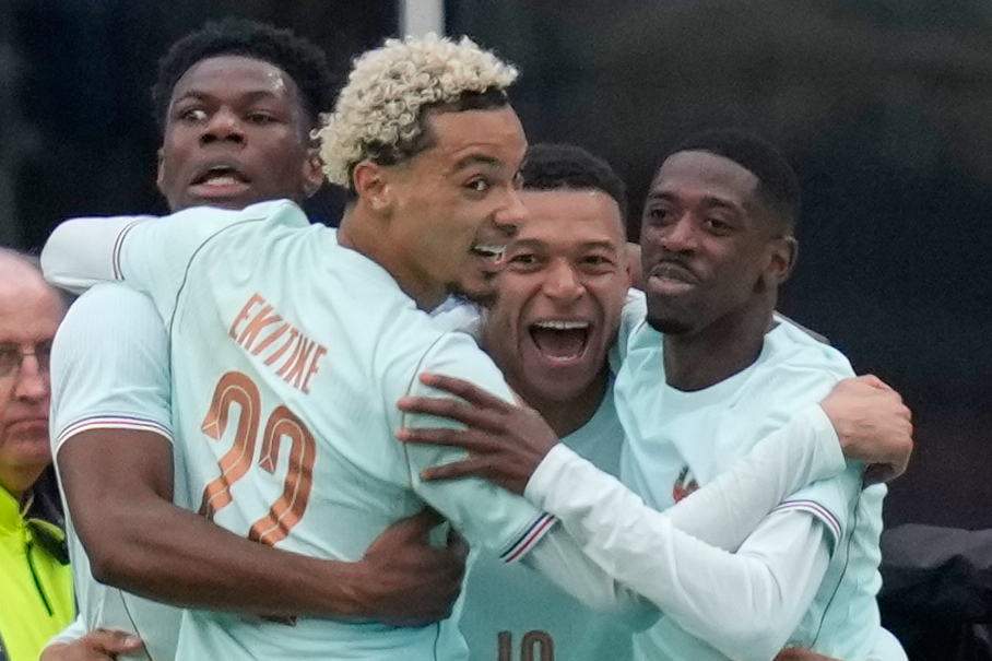 Kylian Mbappe of France, second right, celebrates after scoring the opening goal during the international friendly soccer match between Brazil and France in Foxborough, Mass, Thursday, March 26, 2026. 