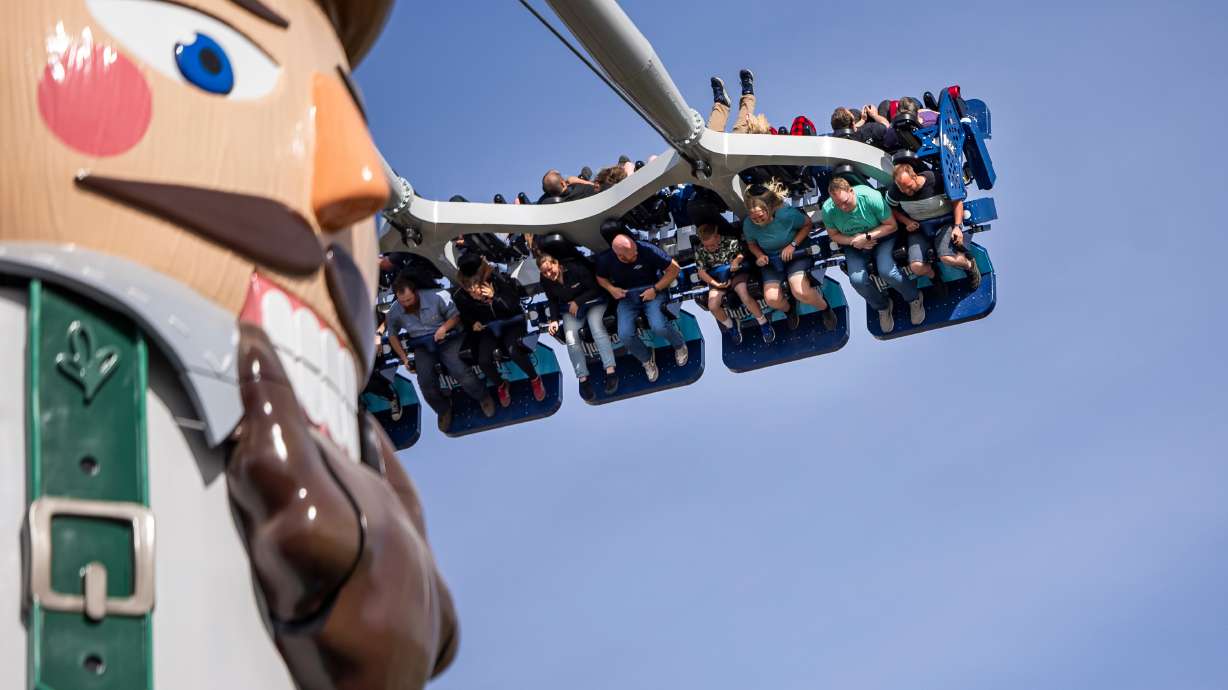 People ride Nutcracker during a preview event for the new ride at Lagoon Amusement Park in Farmington on Thursday.