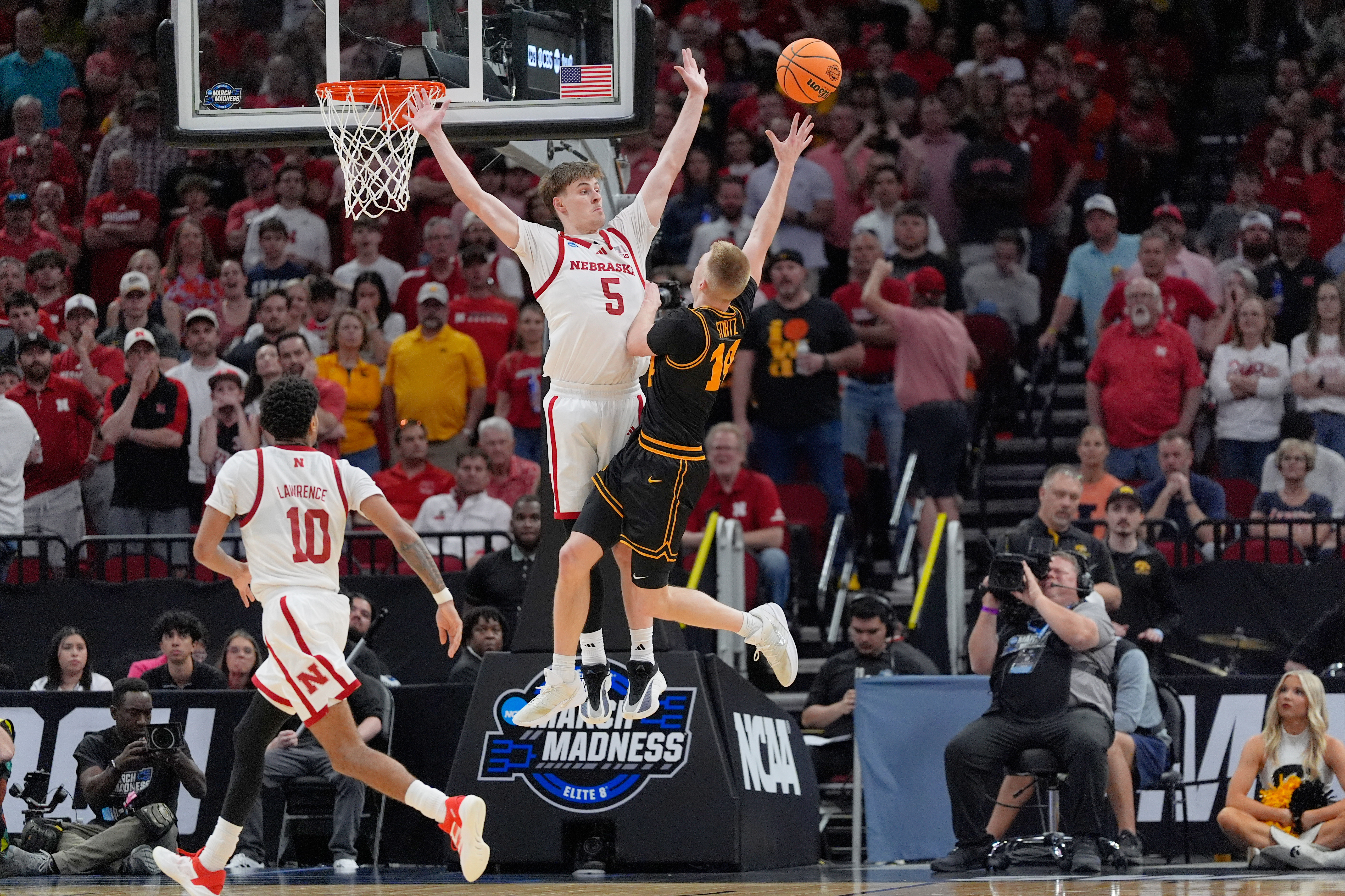 Ninth-seeded Iowa continues improbable March run, beating Nebraska 77-71 to reach Sweet 16