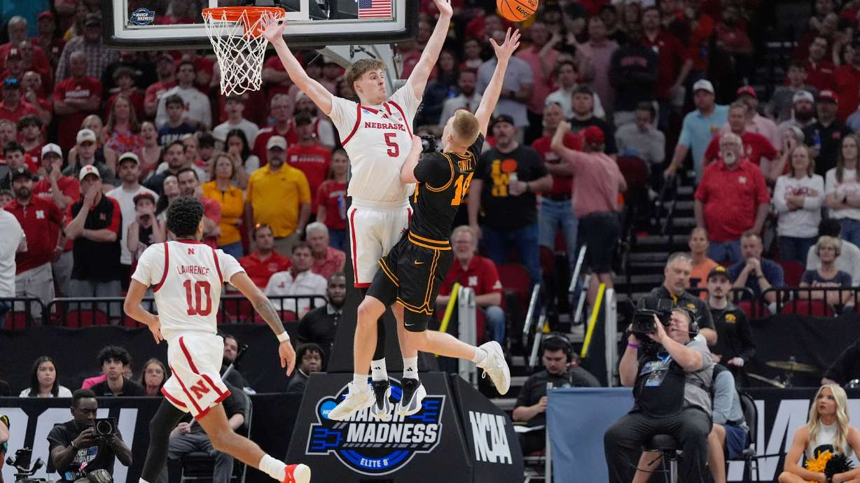 Iowa guard Bennett Stirtz (14) shoots as Nebraska forward Braden Frager (5) defends during the second half in the Sweet 16 of the NCAA college basketball tournament Thursday, March 26, 2026, in Houston.