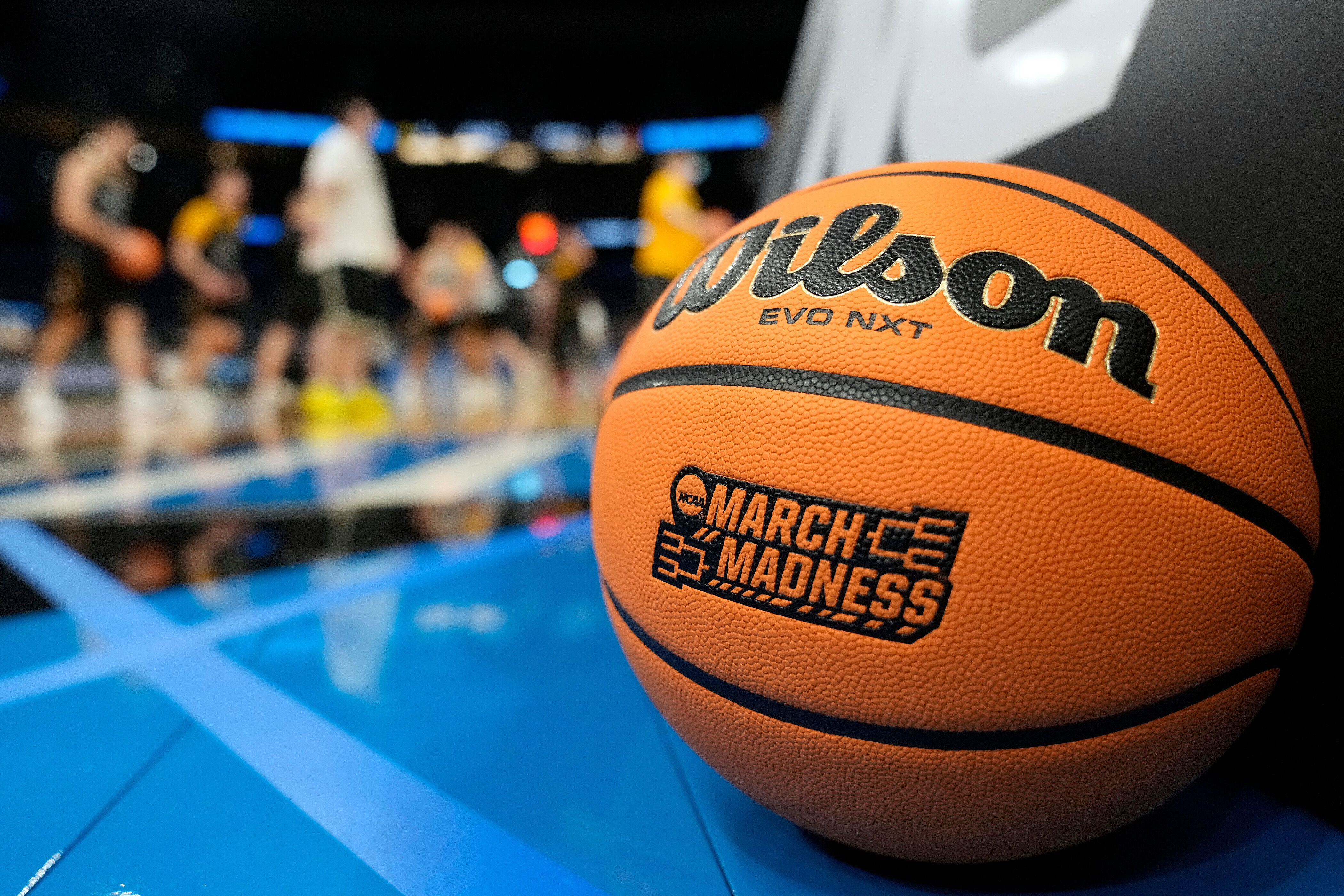 A March Madness basketball rests on the court as Iowa runs drills during practice at the NCAA college basketball tournament Thursday, March 19, 2026, in Tampa, Fla. 