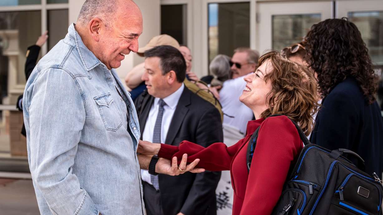 Attorneys Linda Singer and Donald Migliori celebrate after a verdict against Meta for violating state consumer protection laws and ordering the social media company to pay $375 million in damages to the state, March 24, in Santa Fe, N.M.