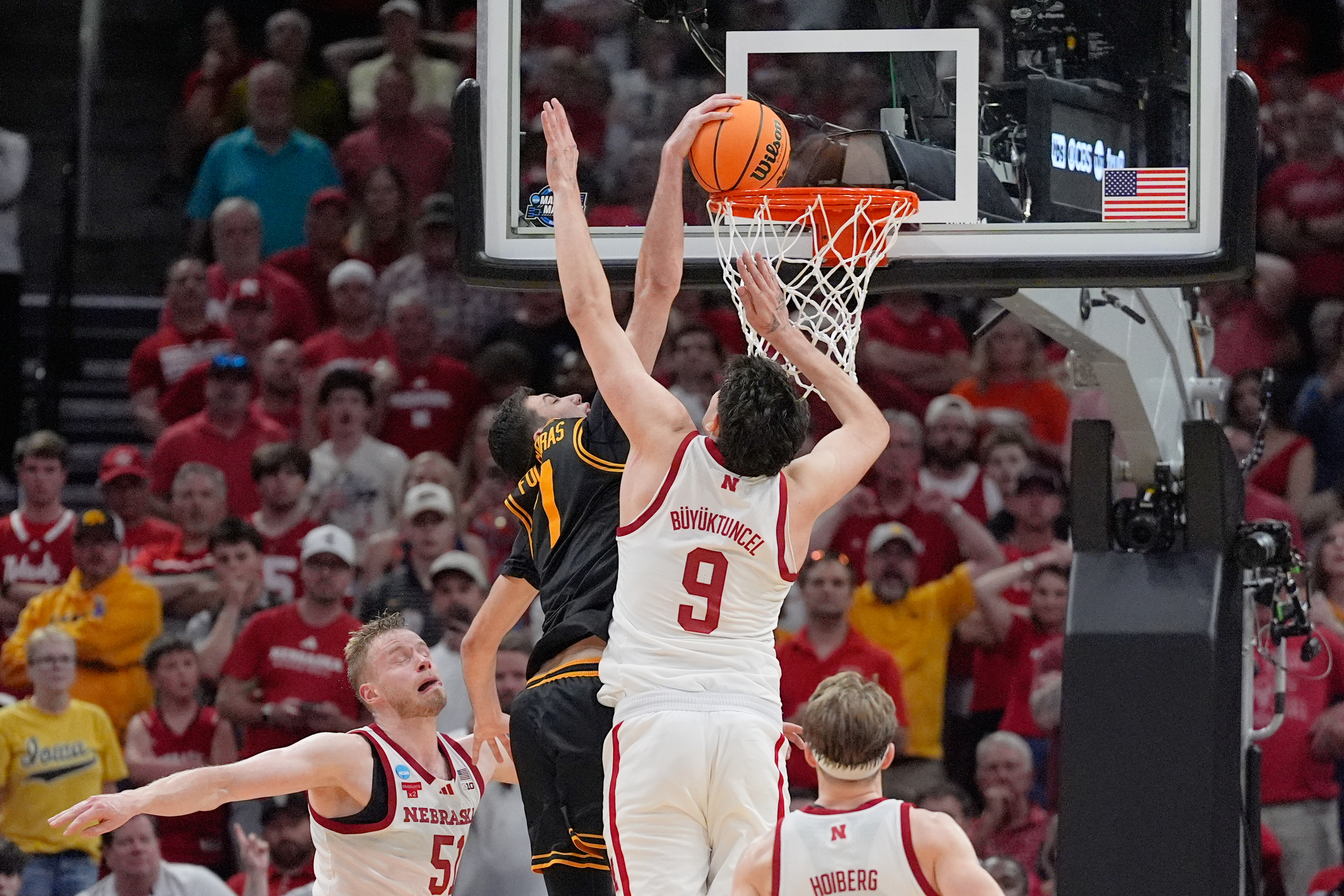 Iowa forward Alvaro Folgueiras (7) dunks over Nebraska forward Berke Buyuktuncel (9) during the second half in the Sweet 16 of the NCAA college basketball tournament Thursday, March 26, 2026, in Houston. 