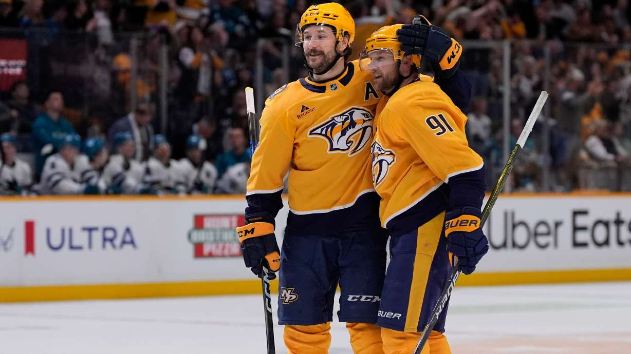 Nashville Predators left wing Filip Forsberg, left, congratulates center Steven Stamkos (91) after his goal during the second period of an NHL hockey game against the San Jose Sharks, Tuesday, March 24, 2026, in Nashville, Tenn.