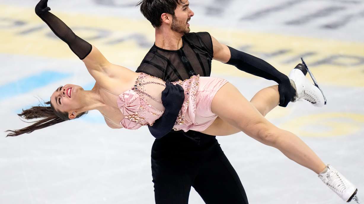 Laurence Fournier Beaudry and Guillaume Cizeron from France perform during the ice dance rhythm dance at the Figure Skating World Championships in Prague, Czech Republic, Friday, March 27, 2026.