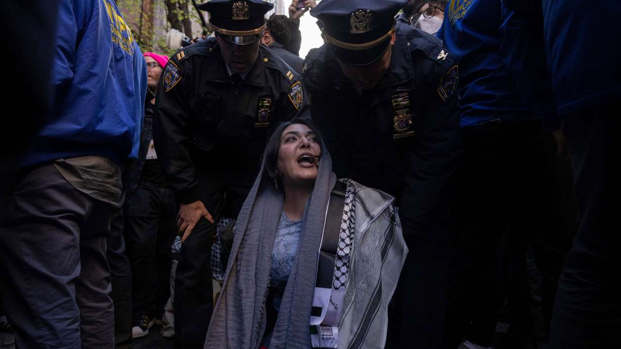 Police detain Nerdeen Kiswani, an organizer of pro-Palestinian demonstration group "Within Our Lifetime" during a protest, Friday, April. 12, 2024, in New York.