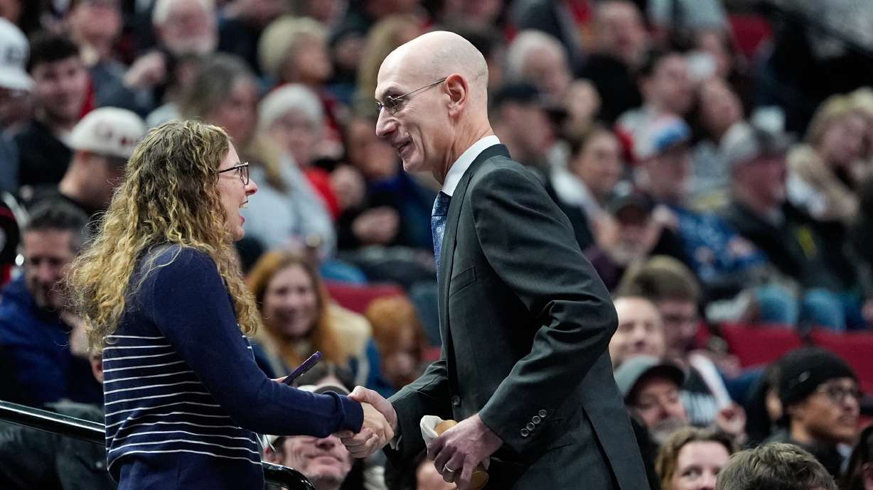 NBA commissioner Adam Silver greets a fan during an NBA basketball game between the Portland Trail Blazers and the Utah Jazz, Friday, March 13, 2026, in Portland, Ore.