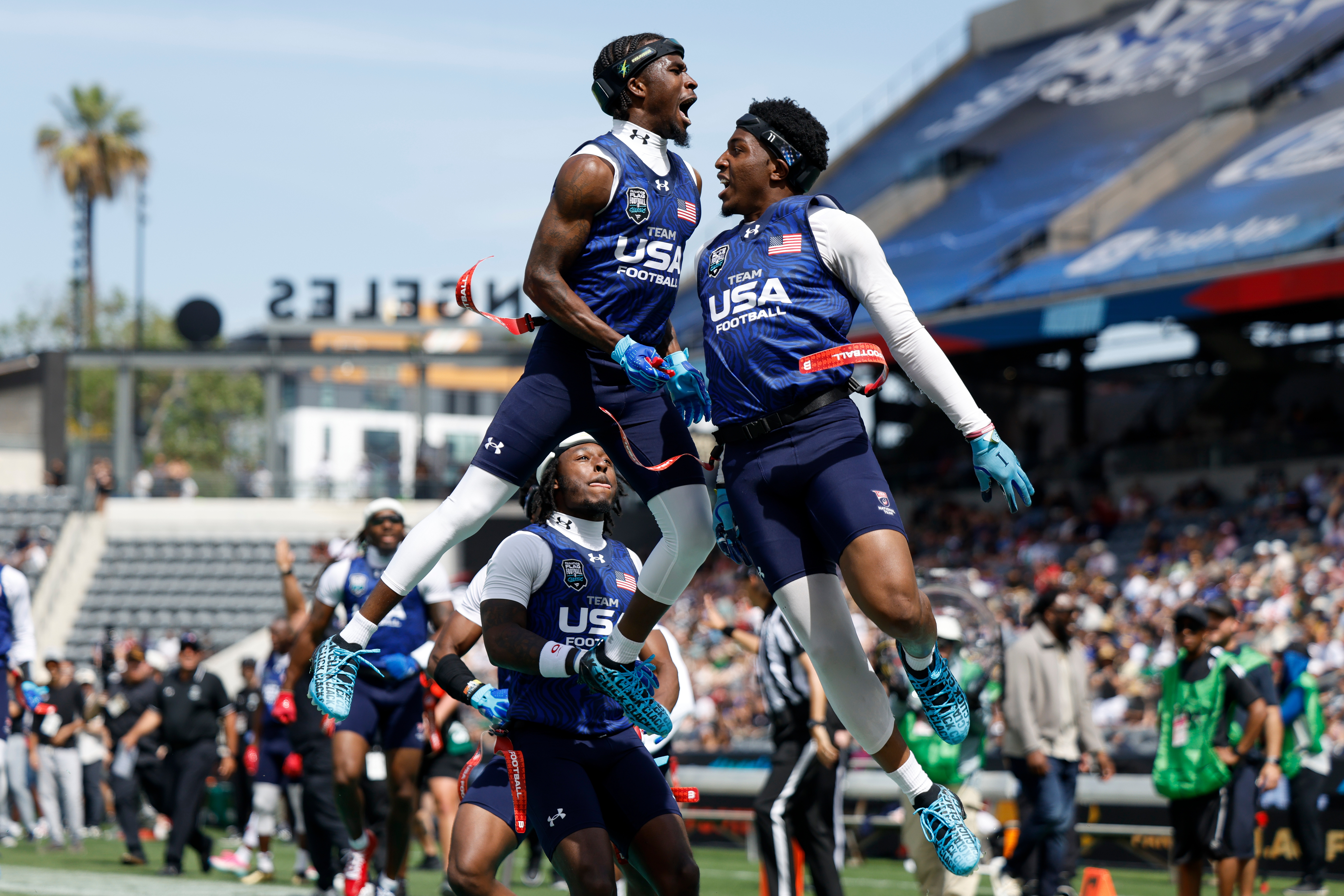 U.S. National Flag team's Isaiah Calhoun celebrates with teammate Shawn Theard Jr. the Fanatics Flag Football Classic against the Wildcats FFC, Saturday, March 21, 2026, in Los Angeles. 