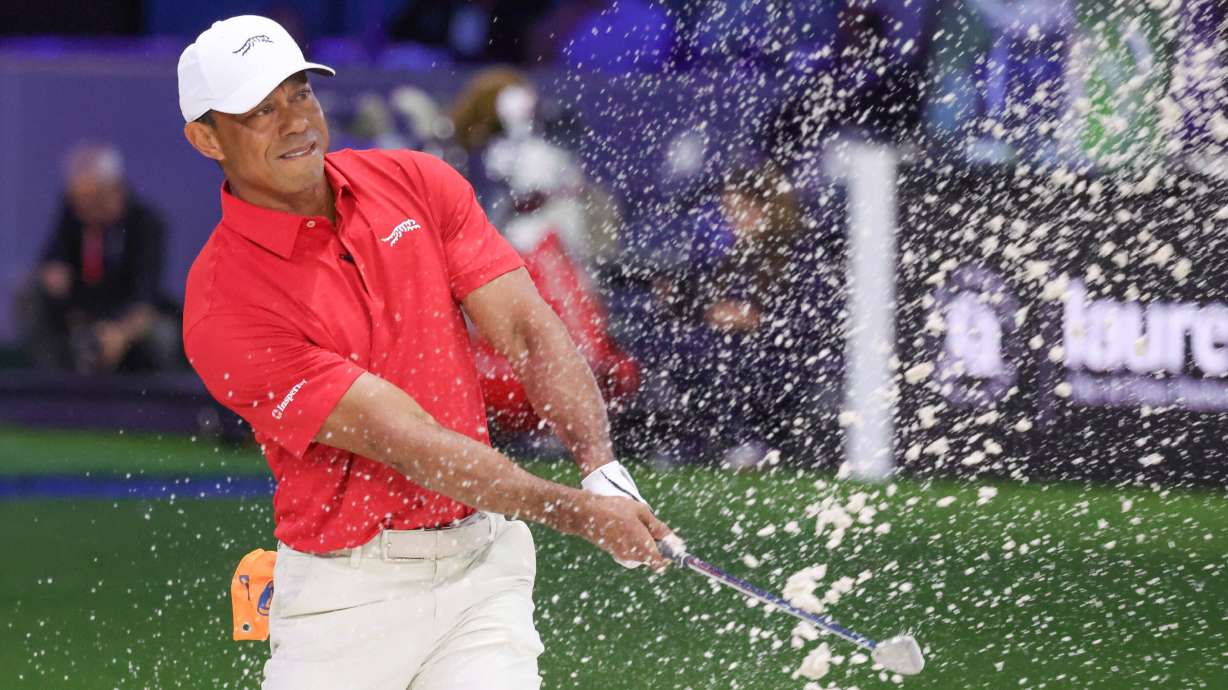 Tiger Woods of the Jupiter Links Golf Club plays a shot from a bunker on the eighth hole, during final day of the TGL golf tournament, Tuesday, in Palm Beach Gardens, Fla.