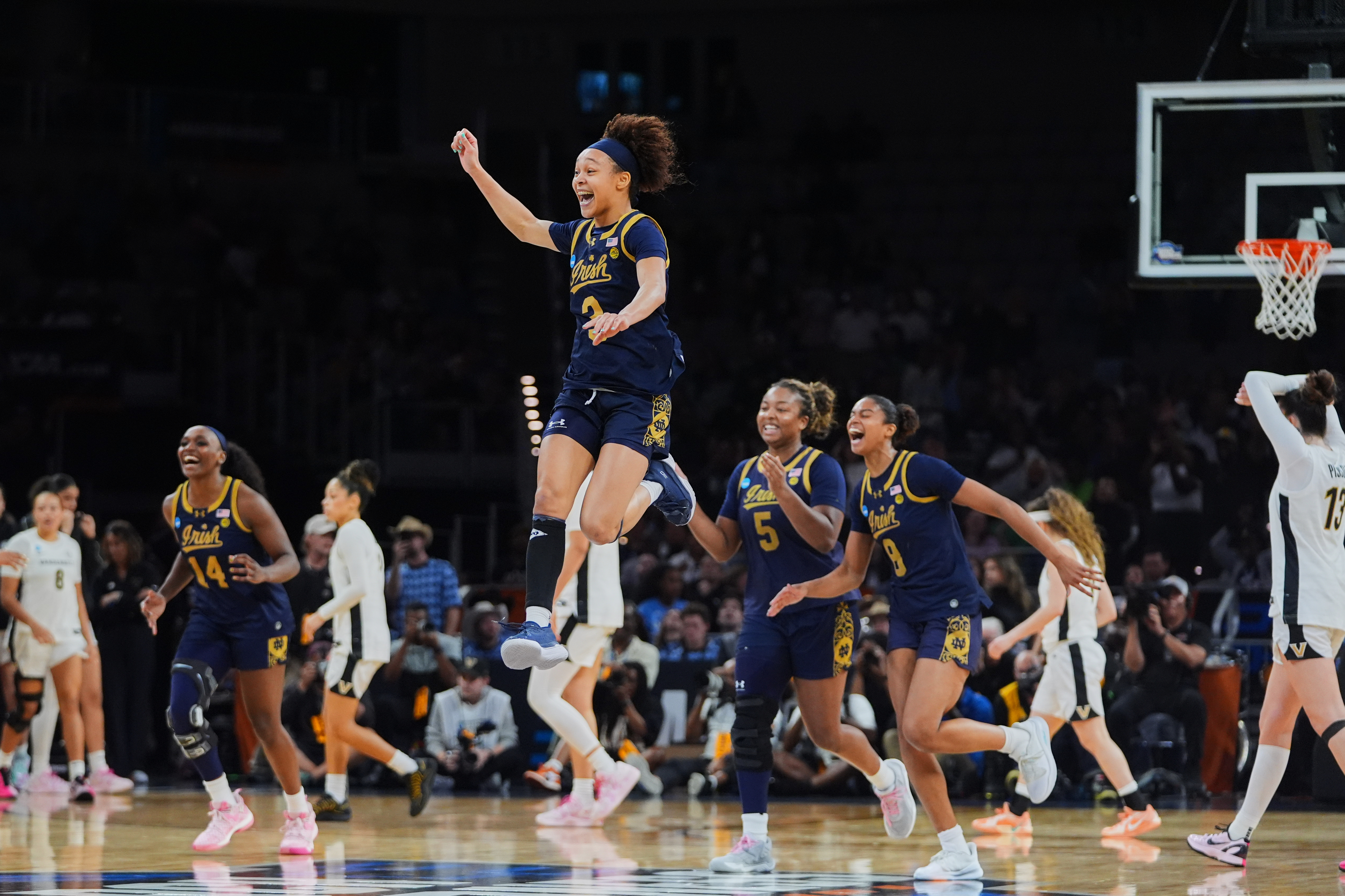 Notre Dame guard Hannah Hidalgo, top, and teammates celebrate the teams win against Vanderbilt in the Sweet 16 of the NCAA college basketball tournament, Friday, March 27, 2026, in Fort Worth, Texas. 