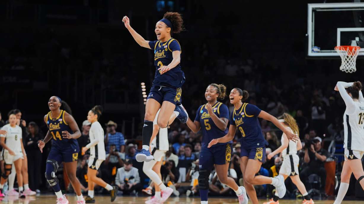 Notre Dame guard Hannah Hidalgo, top, and teammates celebrate the teams win against Vanderbilt in the Sweet 16 of the NCAA college basketball tournament, Friday, March 27, 2026, in Fort Worth, Texas.