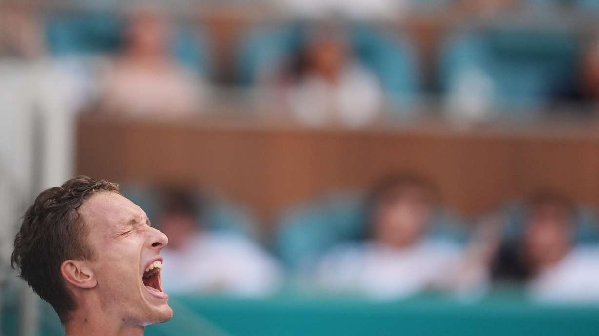 Jiri Lehecka of the Czech Republic shouts as he celebrates after winning a semifinal match against Arthur Fils of France, at the Miami Open tennis tournament, Friday, March 27, 2026, in Miami Gardens, Fla.