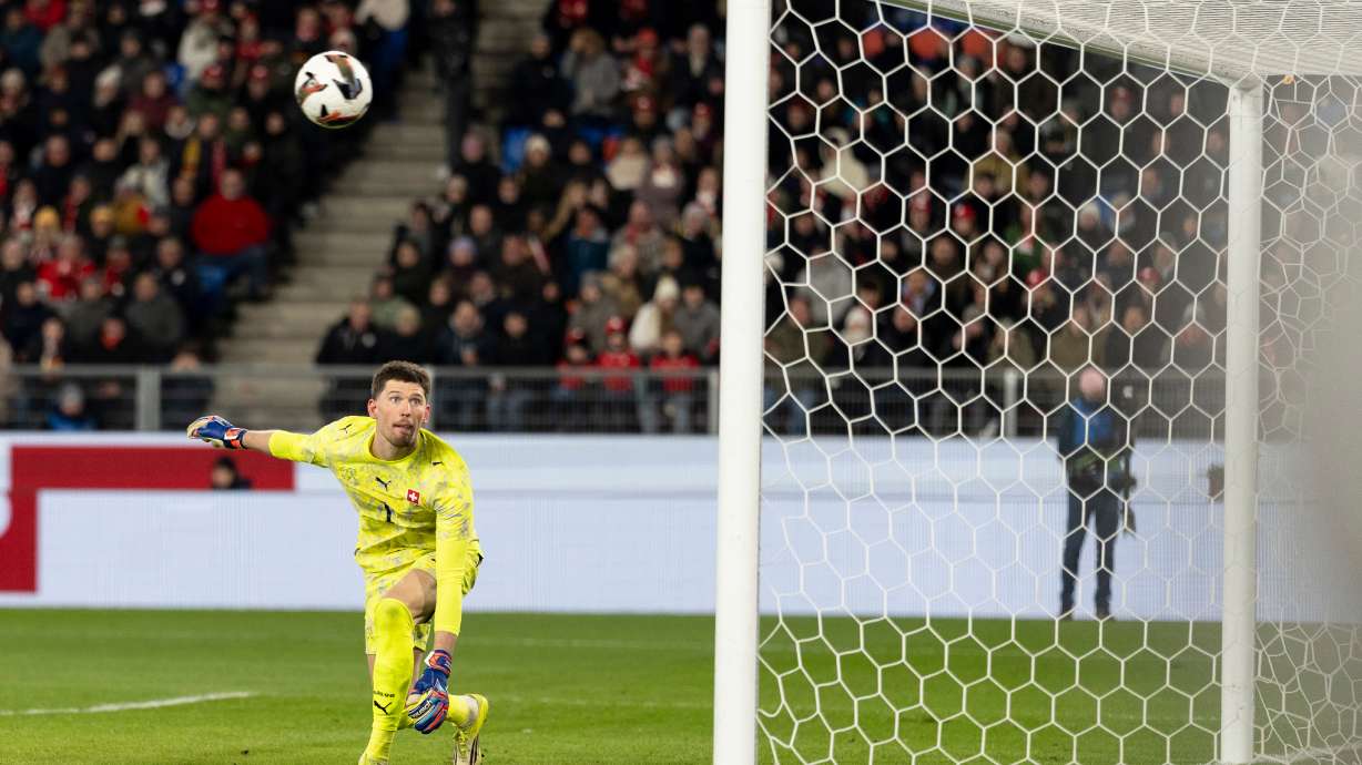 Switzerland's goalkeeper Gregor Kobel watches the ball go into the net for Germany's fourth goal during an international friendly soccer match between Switzerland and Germany in Basel, Switzerland, Friday, March 27, 2026.