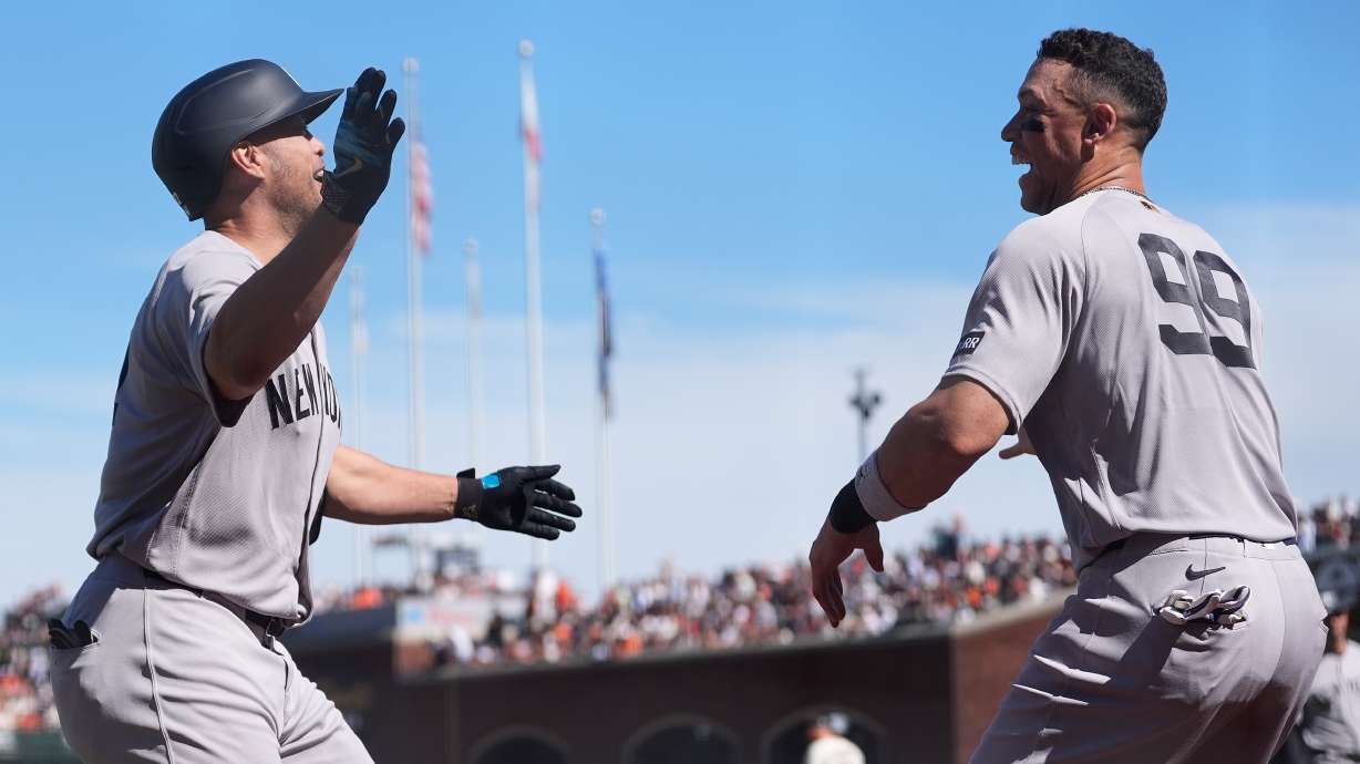 New York Yankees' Giancarlo Stanton, left, is congratulated by Aaron Judge after hitting a home run during the sixth inning of a baseball game against the San Francisco Giants in San Francisco, Friday, March 27, 2026.