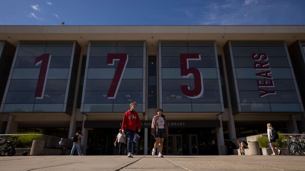 Students exit the J. Willard Marriott Library on the University of Utah campus in Salt Lake City on Sept. 26. Students who attend classes at public higher education institutions will soon be paying a bit more tuition.